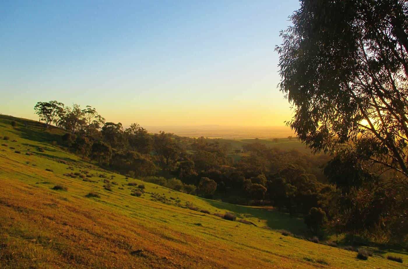 Sunrise over rolling hills and ranges near Melrose on the Mawson Trail