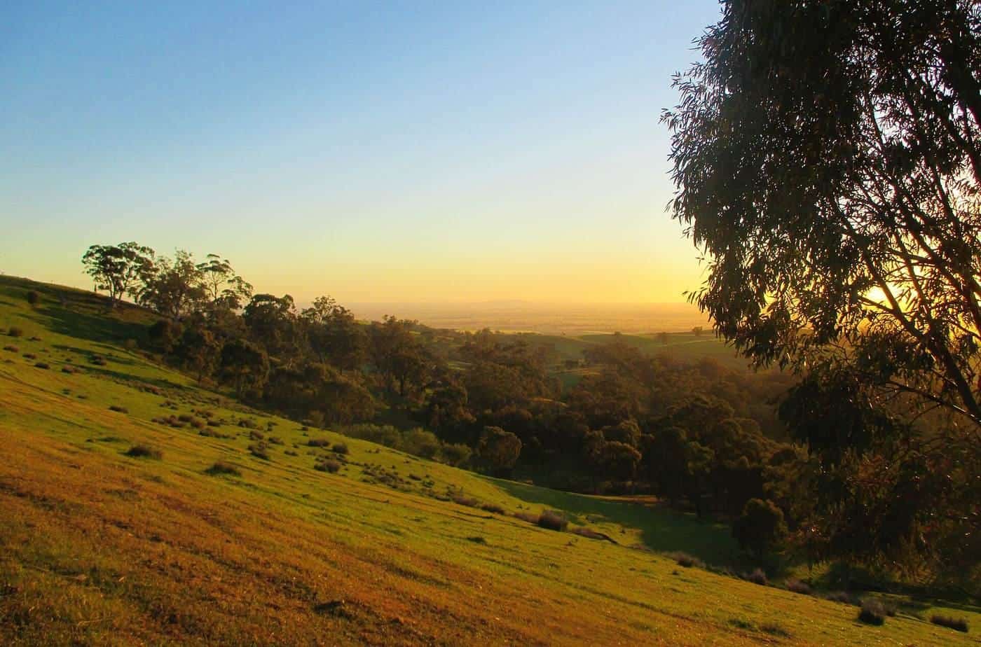 Sunrise over rolling hills and the ranges near Melrose on the Mawson Trail in South Australia